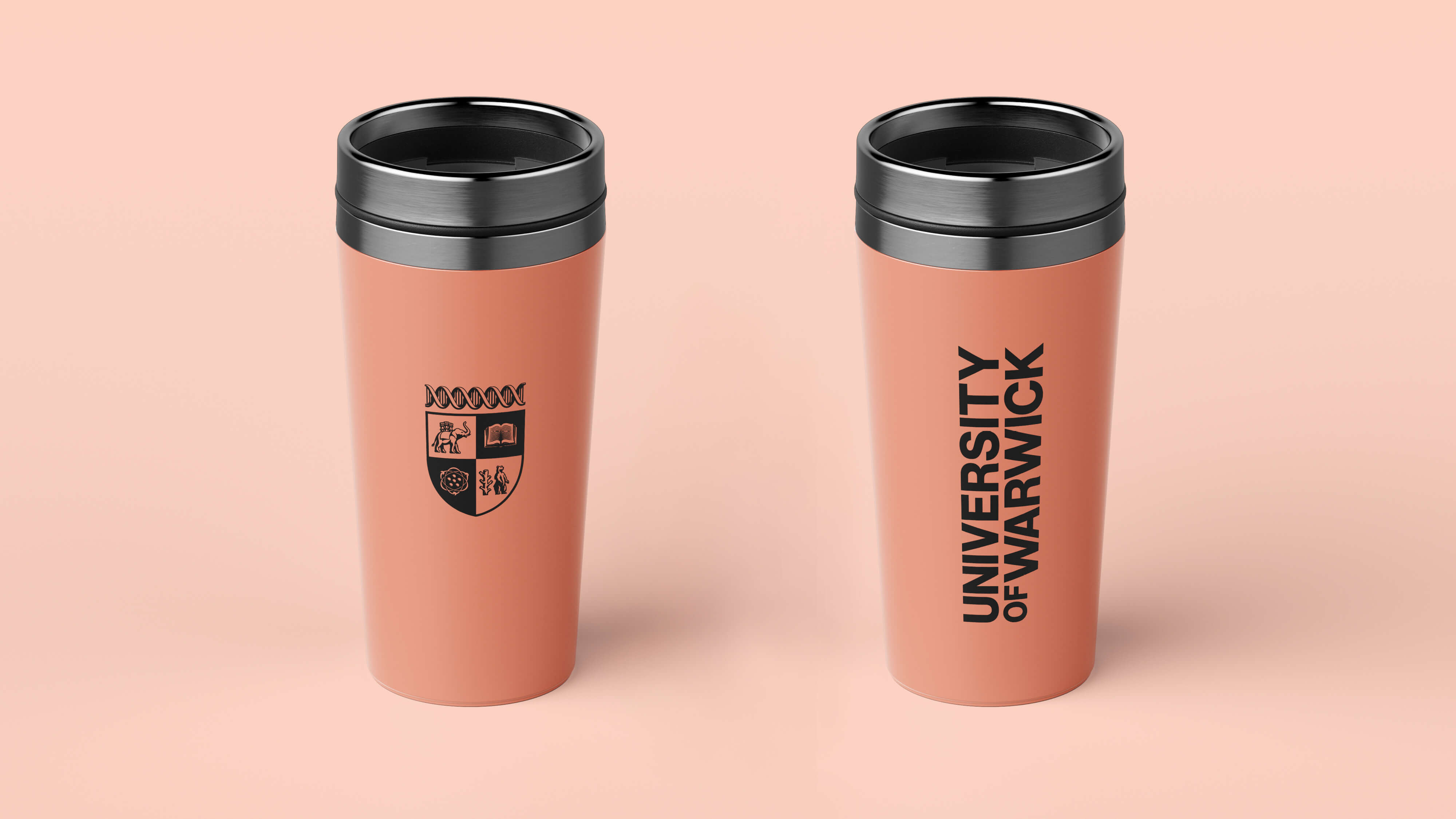 Coral travel mugs with branding.