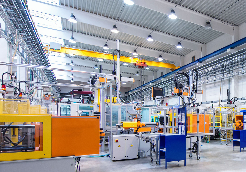 A large white room filled with blue and yellow machinery