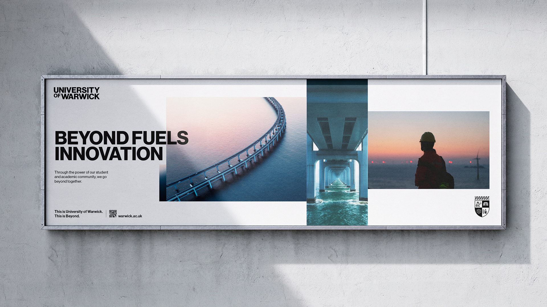 A very large rectangular billboard on a grey wall displays the words "Beyond fuels innovation" and the University of Warwick logo.