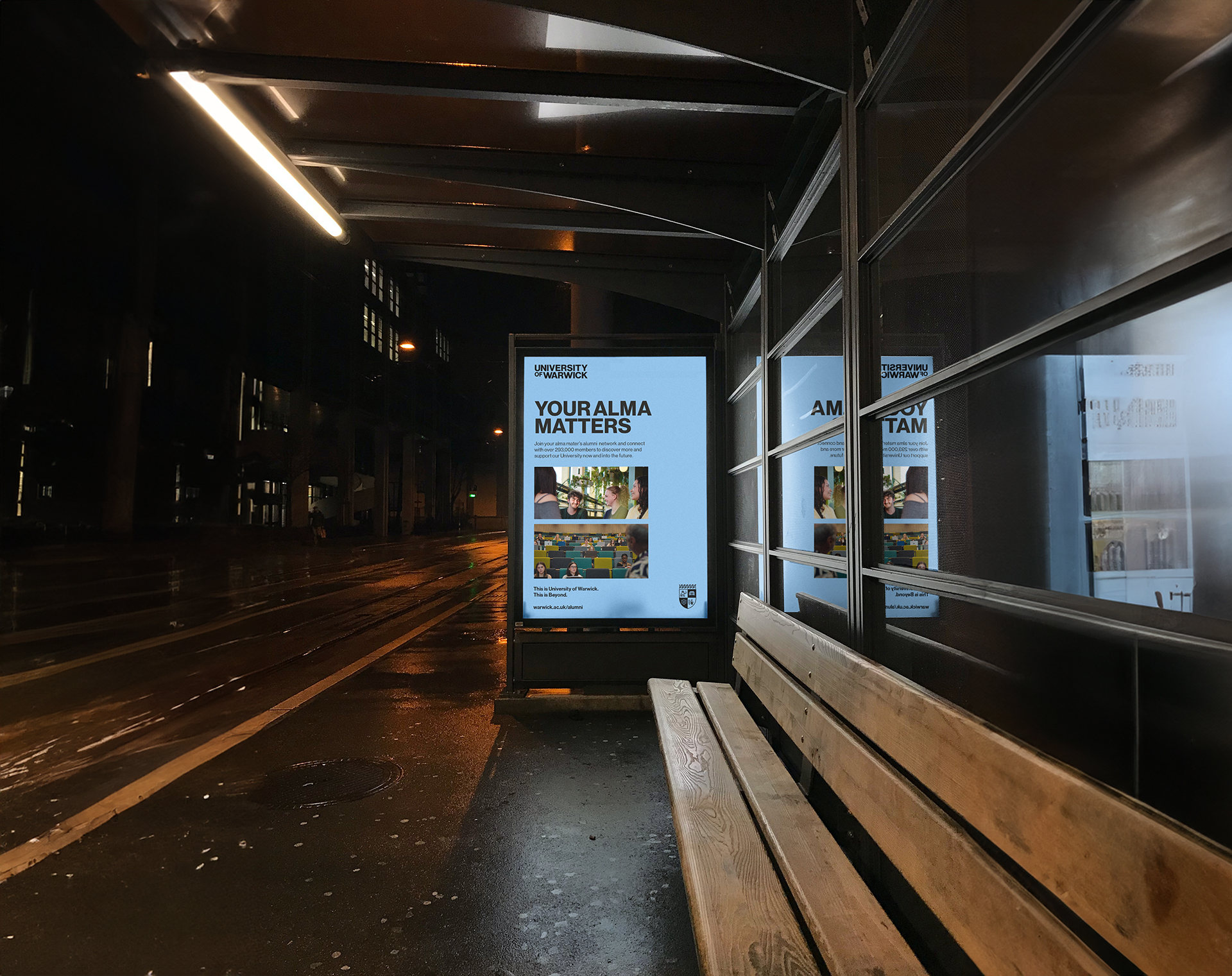 Bus stop advertising board showing University of Warwick students talking