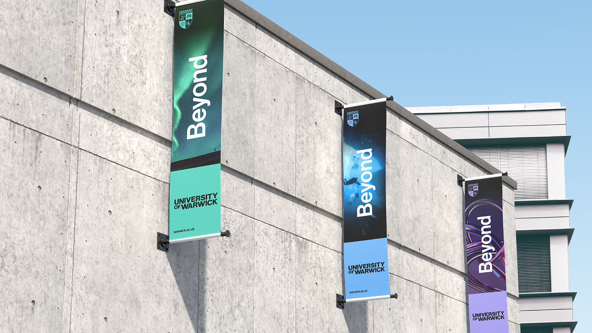 Three banners on side of building with word 'Beyond'