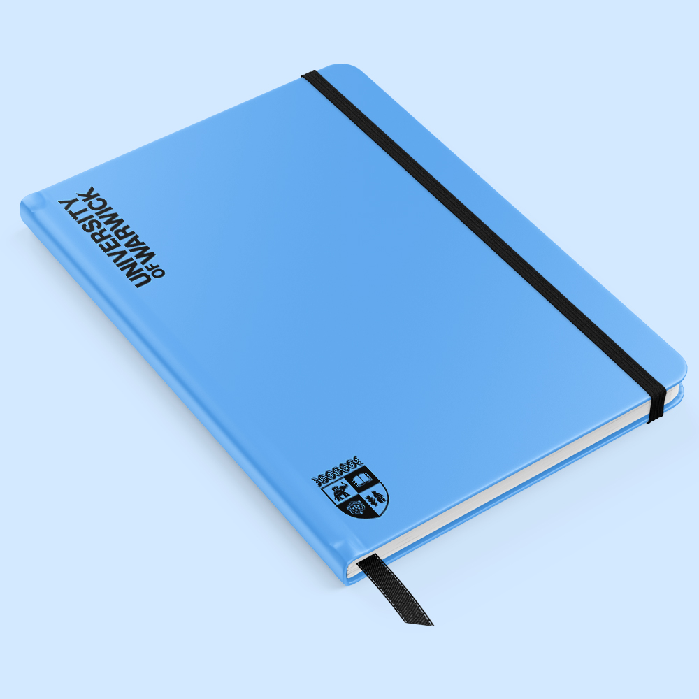 A blue notebook branded with University of Warwick wordmark and crest.